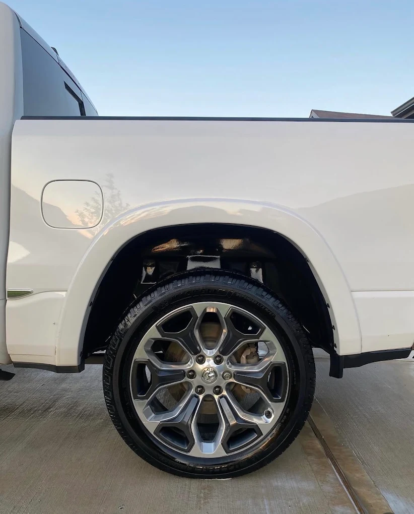 Deep-cleaned wheel and wet-look tire shine on a Ram 1500